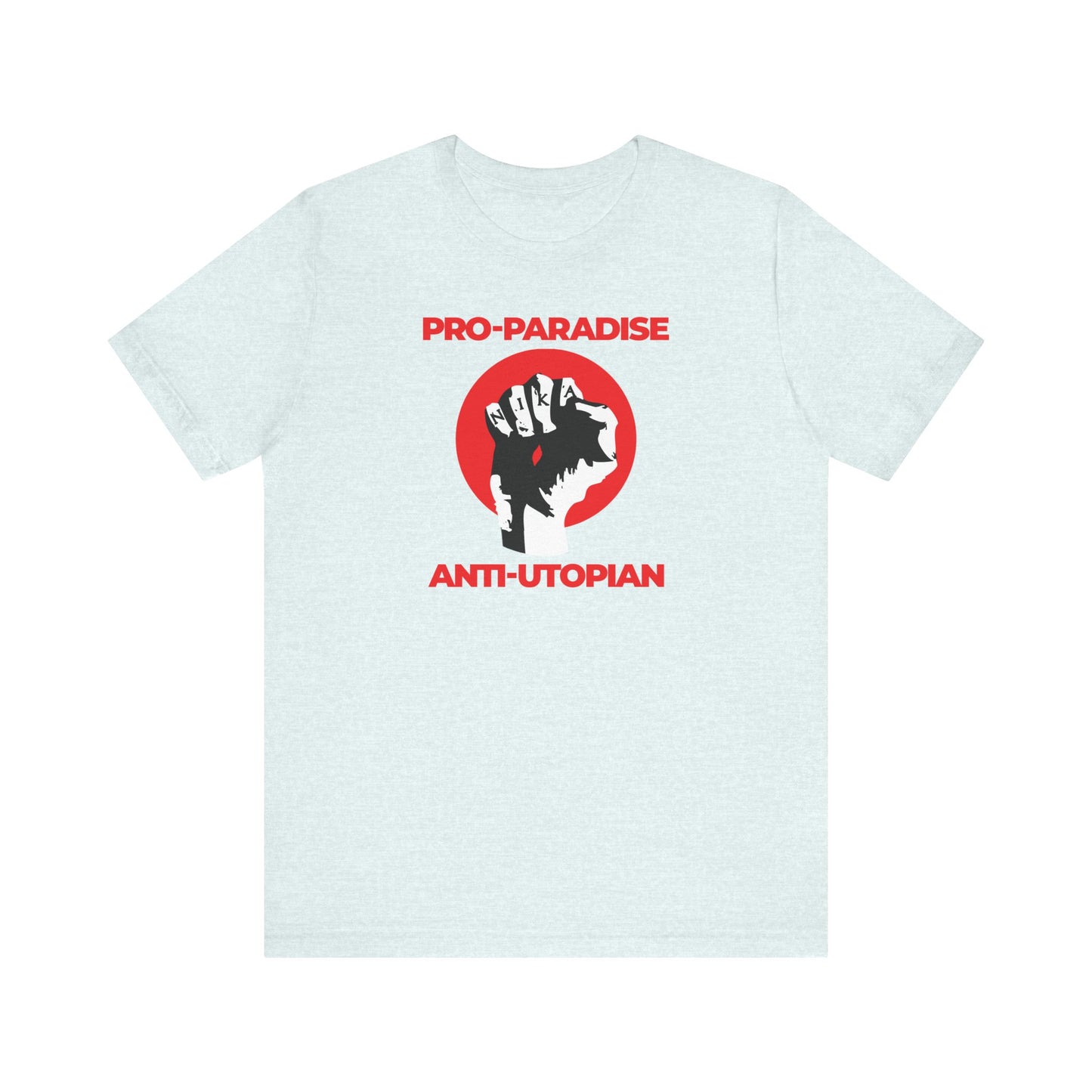 Heather Ice Blue unisex tee with raised fist, red circle, and “PRO-PARADISE ANTI-UTOPIAN”—inspired by Seraphim Rose—features “Jesus Christ Crucified NIKA Fist” and calls to resist the dominant secular paradigm. Lightweight cotton.