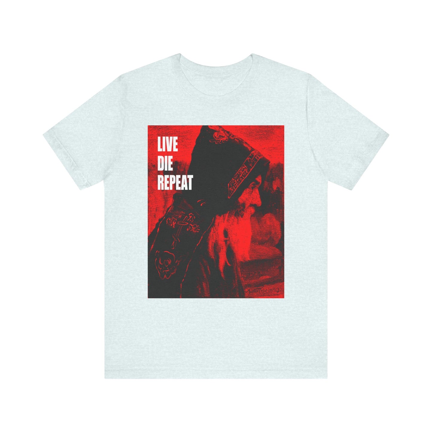 Heather ice blue unisex tee featuring Mikhail Nesterov’s Orthodox monk art and the bold phrase “Die Every Day, You Will Live Forever”—an ascetic message inspired by St Antony the Great. Lightweight cotton comfort.