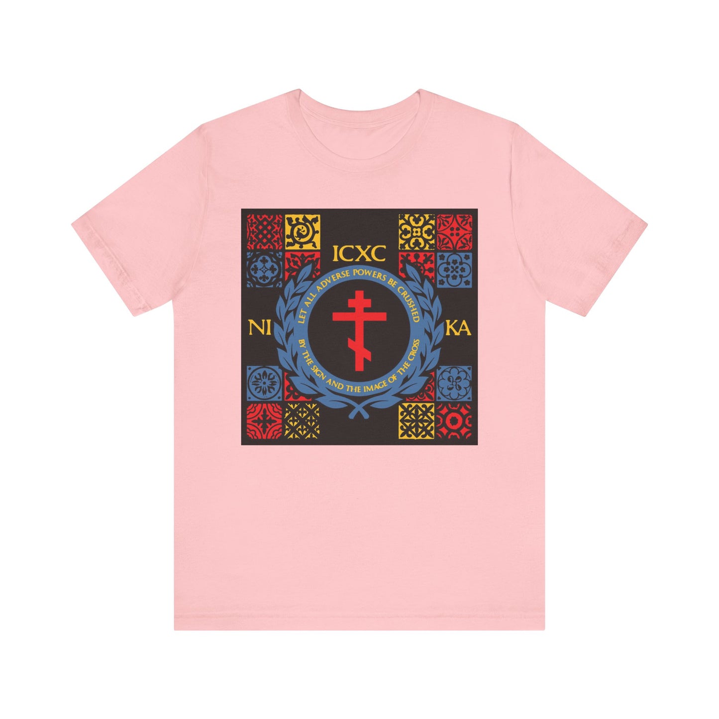 Pink “Let All Adverse Powers Be Crushed” lightweight cotton t-shirt features a red, yellow & blue medieval tile design inspired by the Katavasia of the Cross and ICXC NIKA—symbolizing triumph, faith, and Moses at the Red Sea.