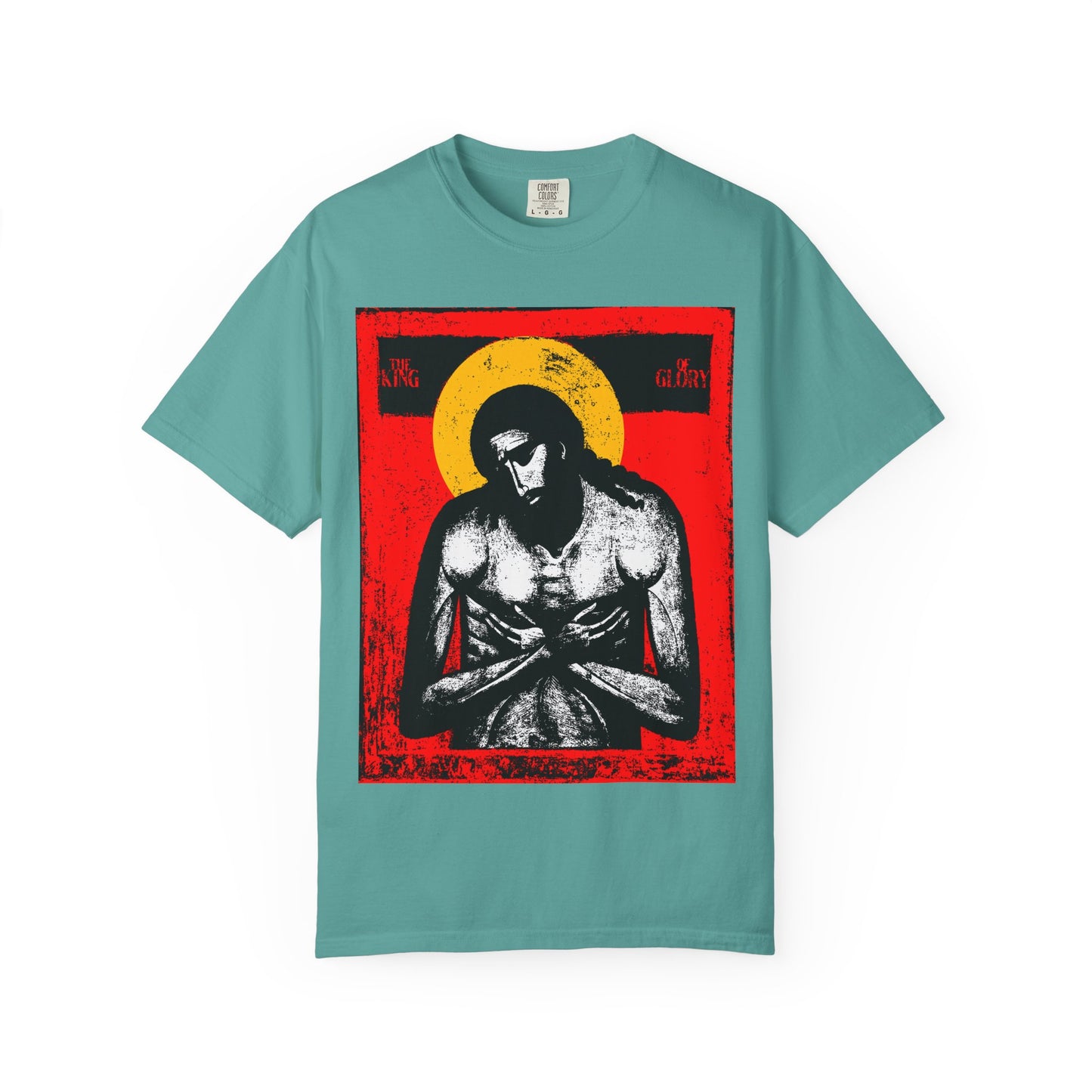 Seafoam heavyweight tee featuring The King of Glory Jesus Christ "Extreme Humility" icon in red, yellow, white, and black—Christian devotional art inspired by Isaiah 53 and the cross; unisex cotton.