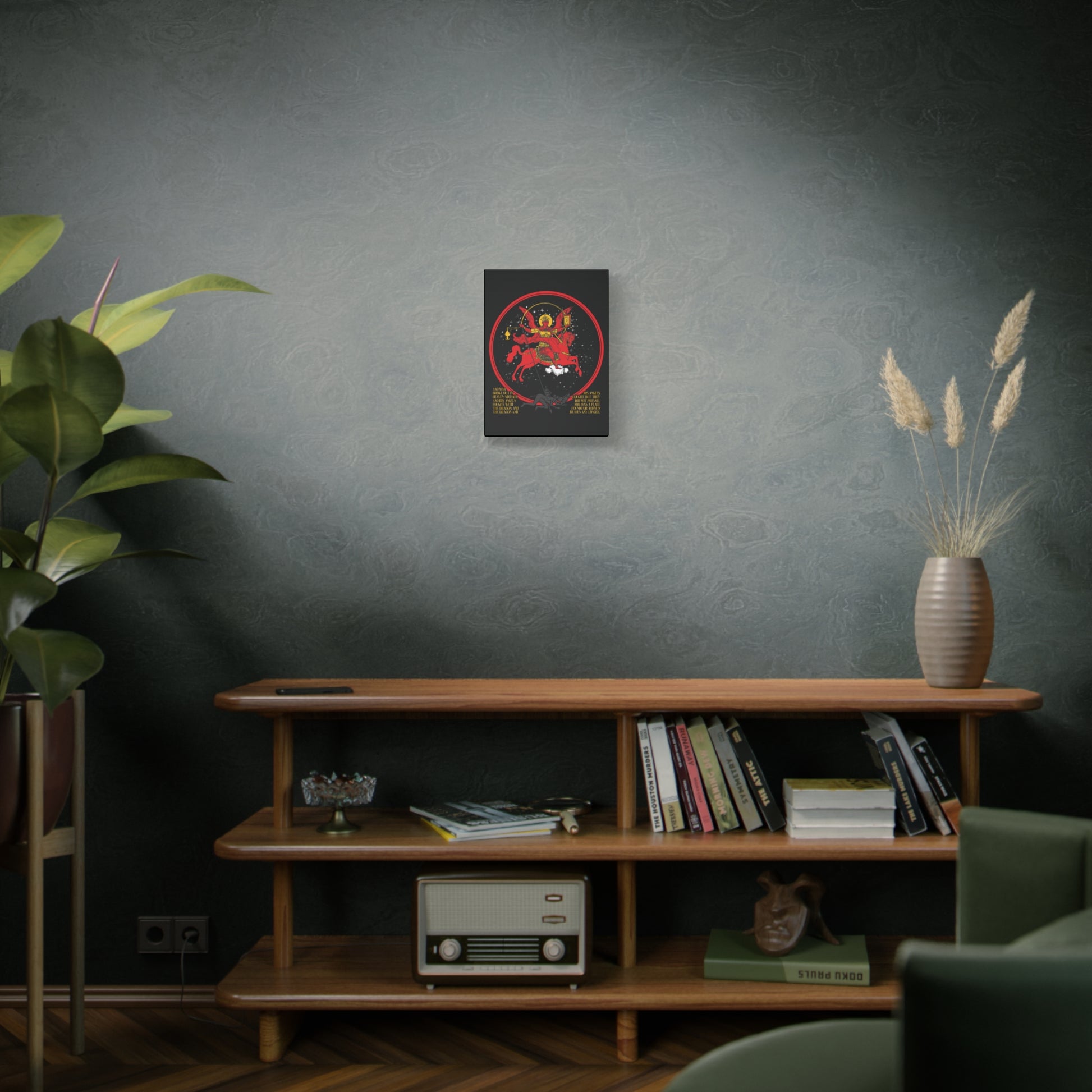 A mid-century shelf with books, a radio, and decor sits against a textured wall, topped by the "Archangel Michael of the Apocalypse Icono-Graphic | War in Heaven (Rev 12:7-9) | Satan Cast Out | Christian Canvas Art.