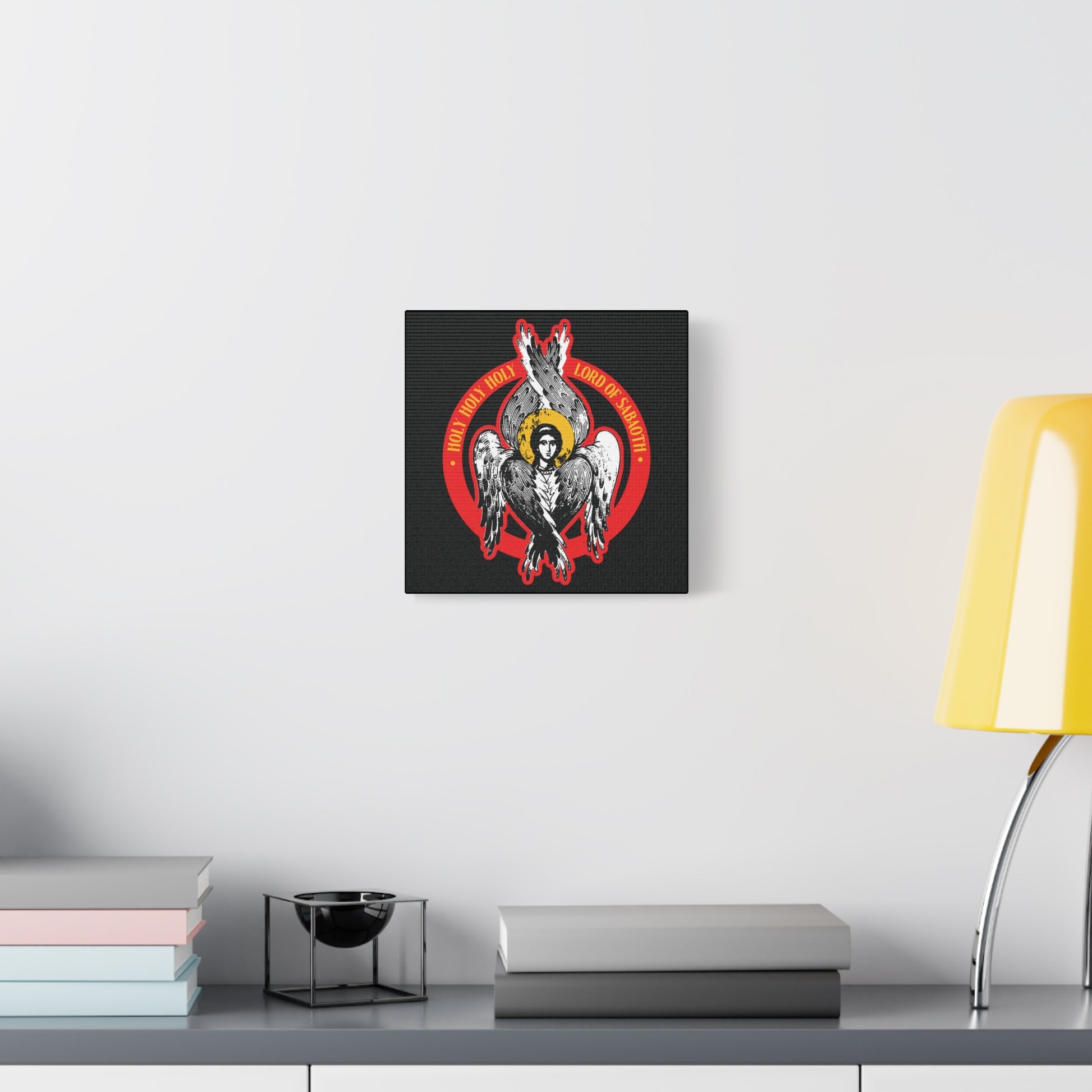 The "Holy Holy Holy, Lord of Sabaoth | Isaiah 6 | Orthodox Seraphim Angel IconoGraphic" Christian wall art hangs above a modern shelf, featuring an abstract seraphim design inspired by the unseen realm.