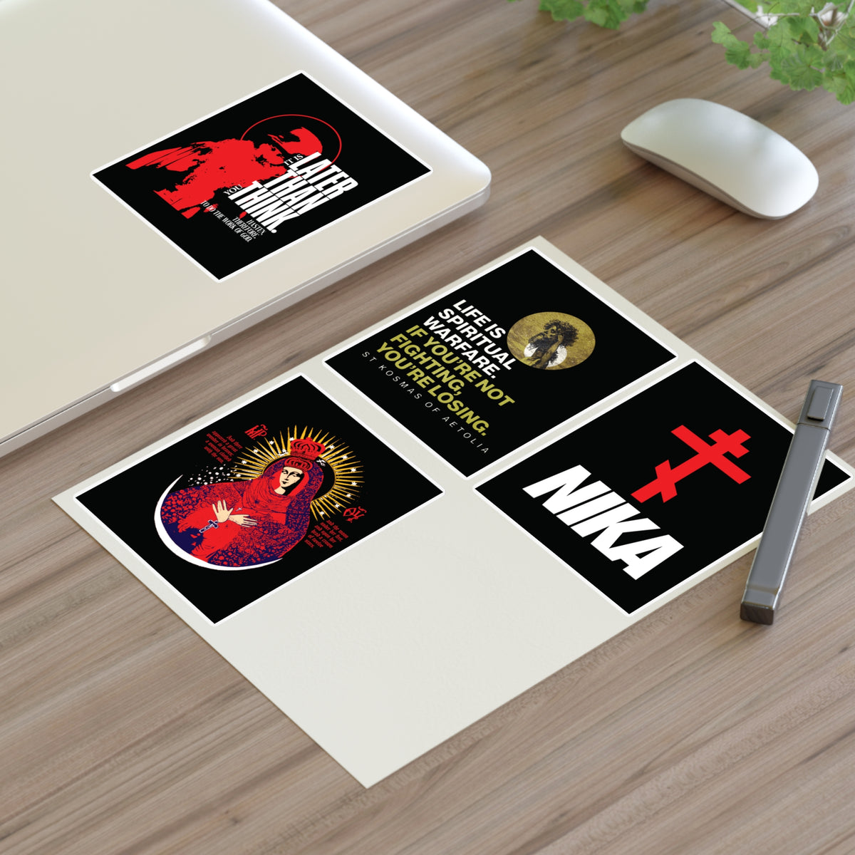 Four Bestseller Orthodox Sticker Mix No. 5 stickers by a laptop and mouse, featuring religious graphic designs.