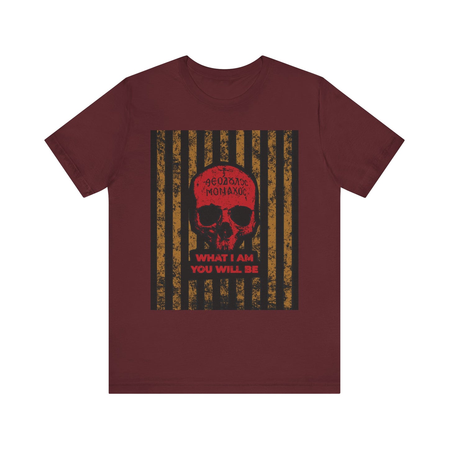 A maroon lightweight cotton unisex t-shirt featuring a striking red monk skull, Greek text, and the phrase "WHAT I AM YOU WILL BE" over black and gold vertical stripes—a memento mori design inspired by Mt Athos monastic tradition and the ascetic ethos of remembrance of death.
