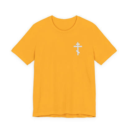 Gold t-shirt featuring a small white embroidered Orthodox cross and “May I Never Boast Except in the Cross of Our Lord Jesus Christ” (Gal 6:14) design on the left chest.