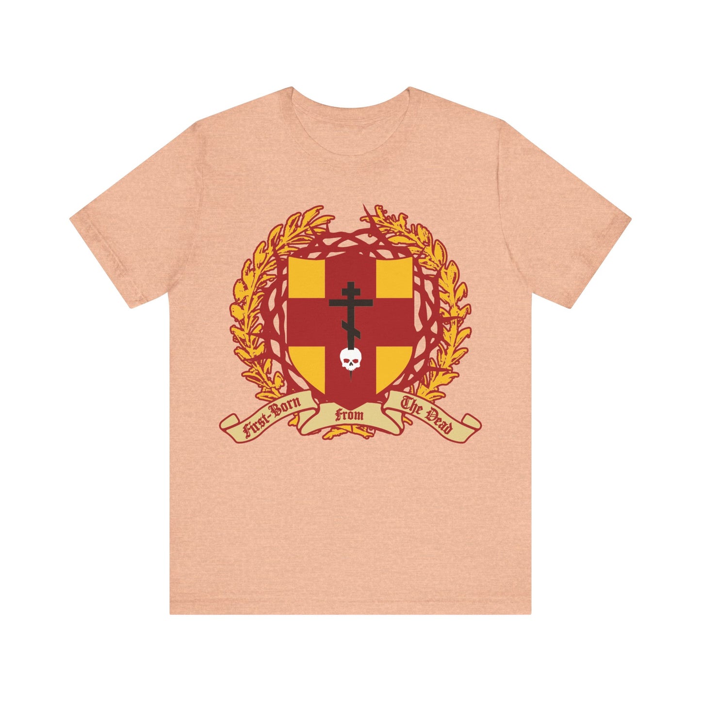 Heather Peach unisex tee featuring an Orthodox cross stabbing a skull, shield with victory wreath and crown of thorns, and "First-Born from the Dead" (Col 1:18), symbolizing redemption through Christ’s blood.