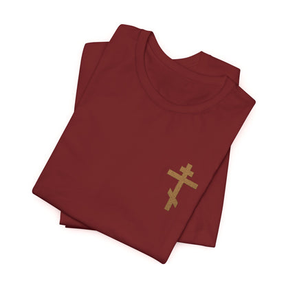 Folded earthtone cotton t-shirt, unisex fit, featuring a small embroidered Orthodox cross and inspired by Galatians 6:14: "May I Never Boast Except in the Cross.