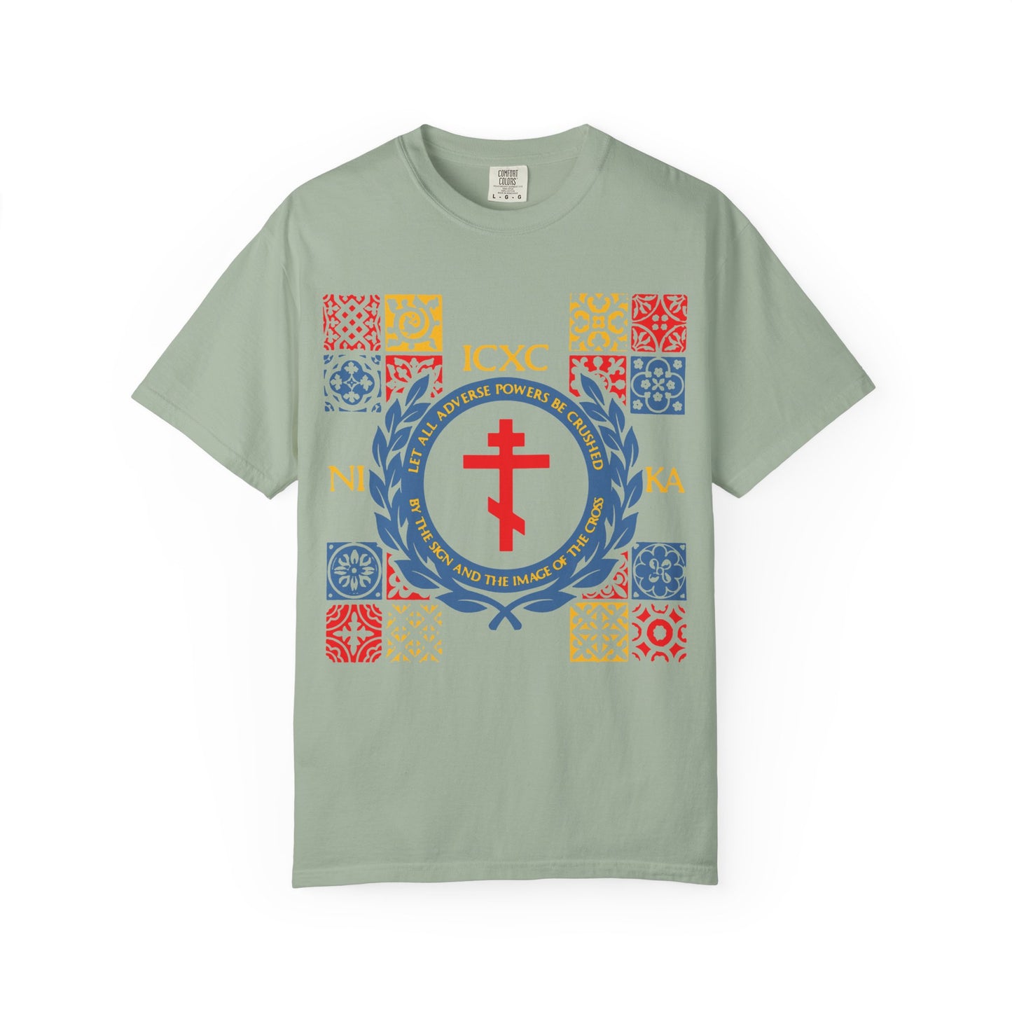Bay heavyweight cotton unisex t-shirt named "Let All Adverse Powers Be Crushed (Red, Yellow & Blue Design)" showcases bold red ICXC NIKA Greek letters referencing Katavasia and a vibrant grid of medieval tile-inspired squares.
