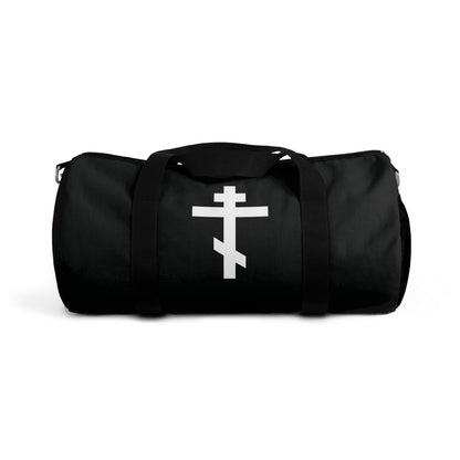 Black gym duffel bag with a white Orthodox cross on the front and the phrase “May I never boast, except in the cross of our Lord Jesus Christ” (Gal 6:14); inspired by Orthodox Christian faith.