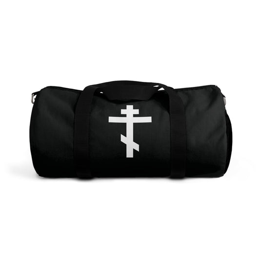 Black gym duffel bag with a white Orthodox cross on the front and the phrase “May I never boast, except in the cross of our Lord Jesus Christ” (Gal 6:14); inspired by Orthodox Christian faith.