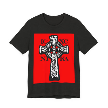 Black Heather ICXC NIKA Celtic Knotwork Cross T-shirt features a bold black and white cross design on a red background, symbolizing "Jesus Christ Conquers" in traditional Orthodox Christian style.