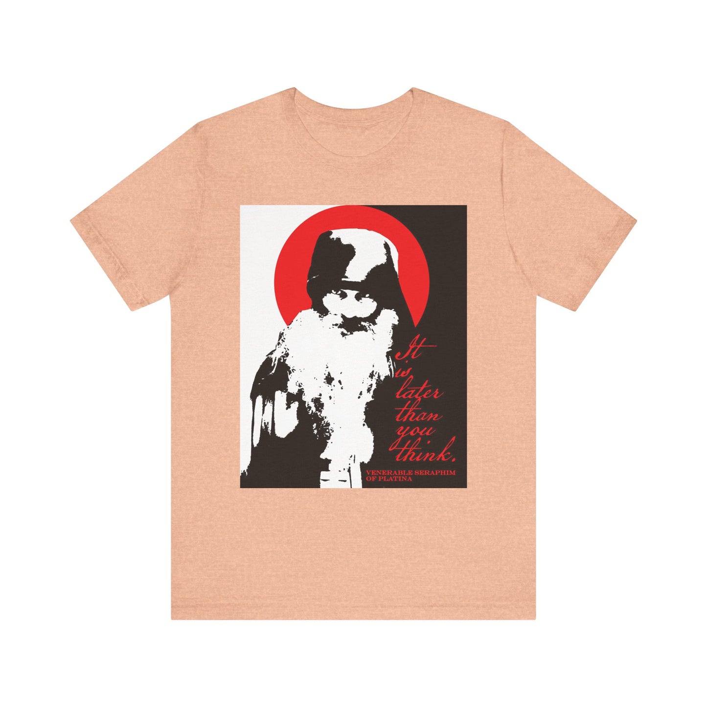 A lightweight unisex cotton t-shirt in Heather Peach featuring a high-contrast black, white, and red design with a stylized bearded figure, the phrase "It’s Later Than You Think," and an homage to Fr Seraphim Rose’s Orthodox spiritual teachings and the memento mori tradition.
