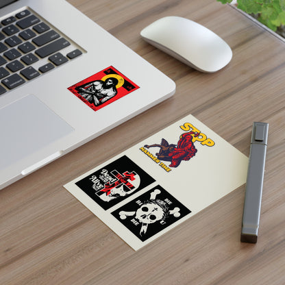 Random Mix No. 1 Four Sticker Sheet | Orthodox Stickers shown on a wooden desk with laptop, mouse, pen & plant.