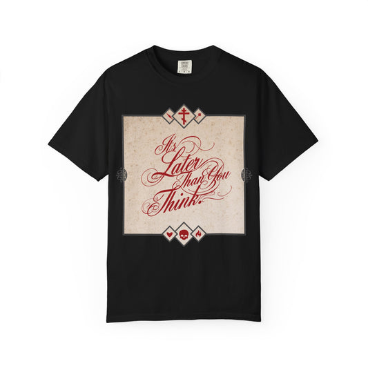 Black "It's Later Than You Think" heavyweight cotton unisex tee featuring ornate red cursive typography on a vintage-style beige background—a memento mori inspired by Seraphim Rose and Orthodox tradition, reminding you to reflect, repent, and prepare for the work of God.