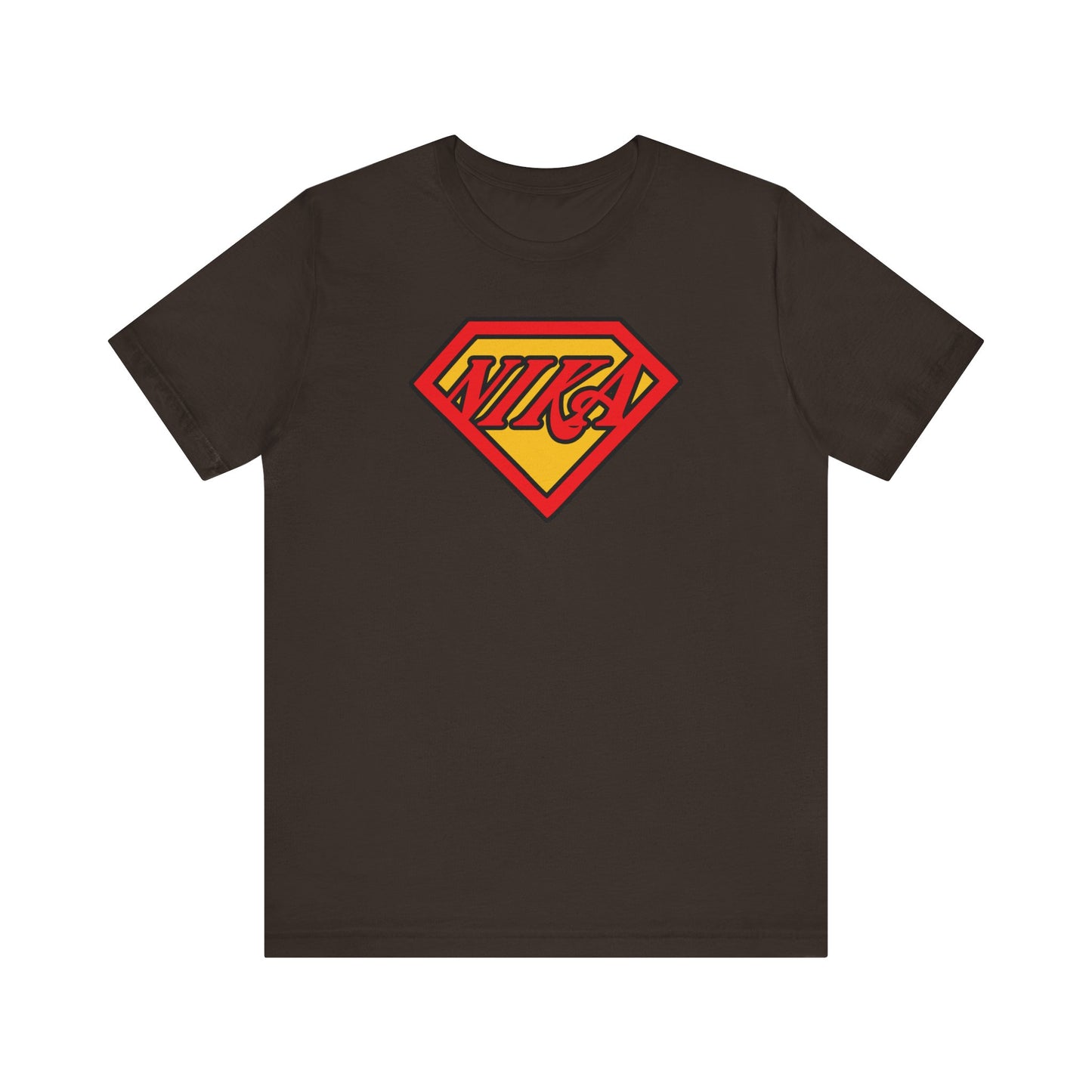 Brown T-shirt featuring a red and yellow superhero emblem with the word NIKA on the chest, representing the strength to conquer passions and honor unwavering faith—a comic book pop culture Orthodox Christian mashup.