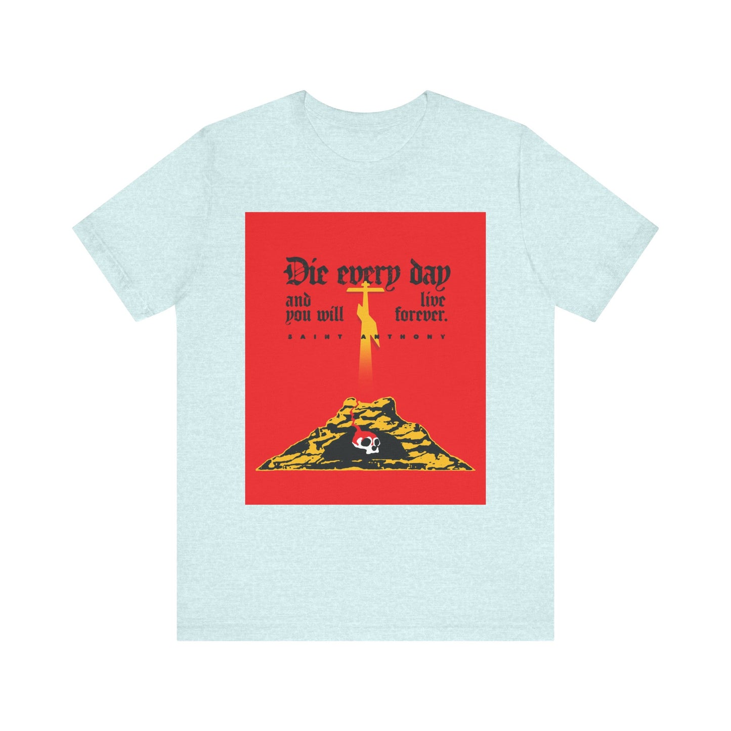 Heather Prism Ice Blue tee featuring a red Golgotha design—cross, Skull of Adam, yellow figure above pyramid, with "Die Every Day and You Will Live Forever." Inspired by St Anthony the Great; lightweight unisex cotton.