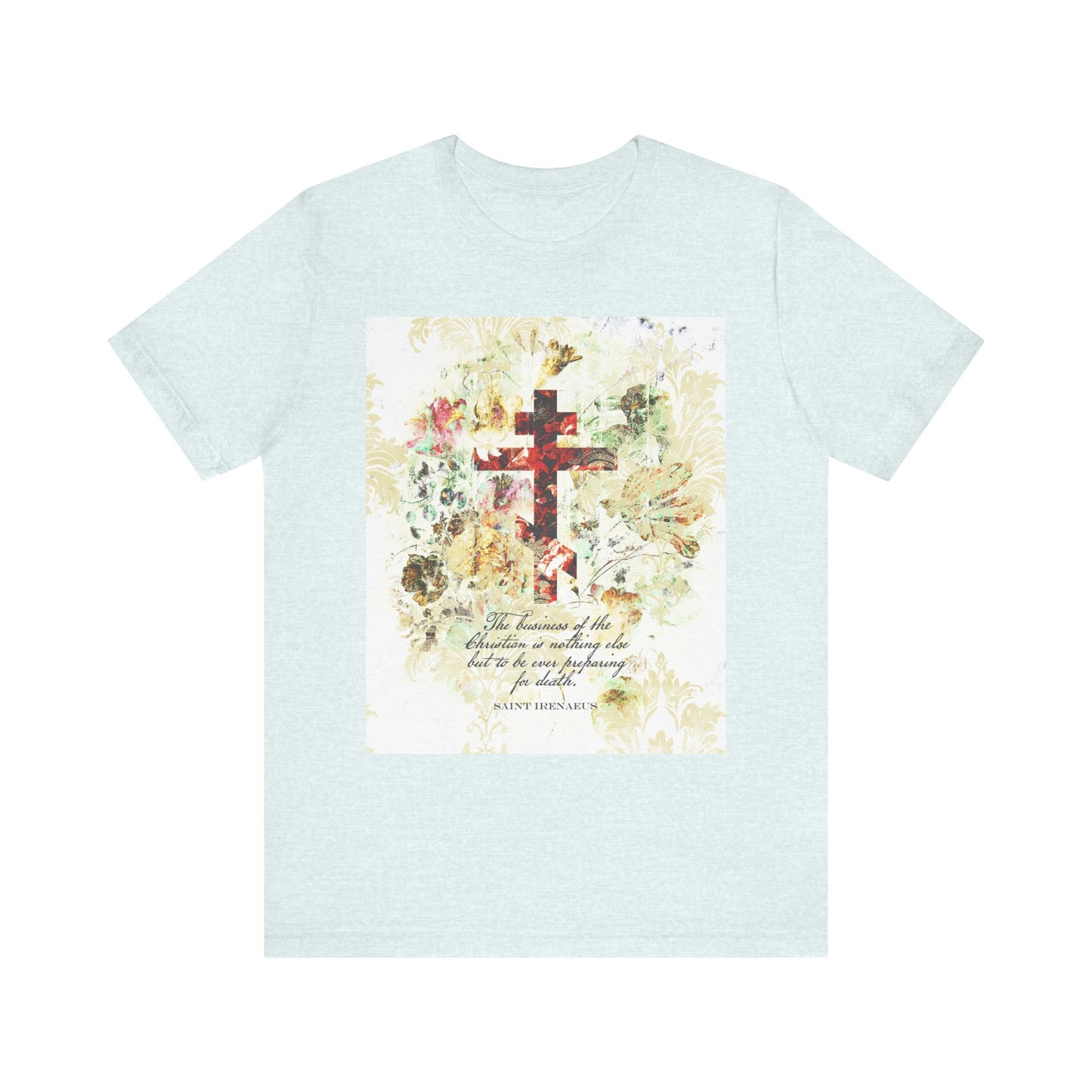 Heather Ice Blue lightweight cotton unisex tee featuring a white and beige floral scrapbook texture cross and an inspirational quote inspired by St. Irenaeus, encouraging thoughtful Christian preparation for death, printed on the front in an arts & crafts style.