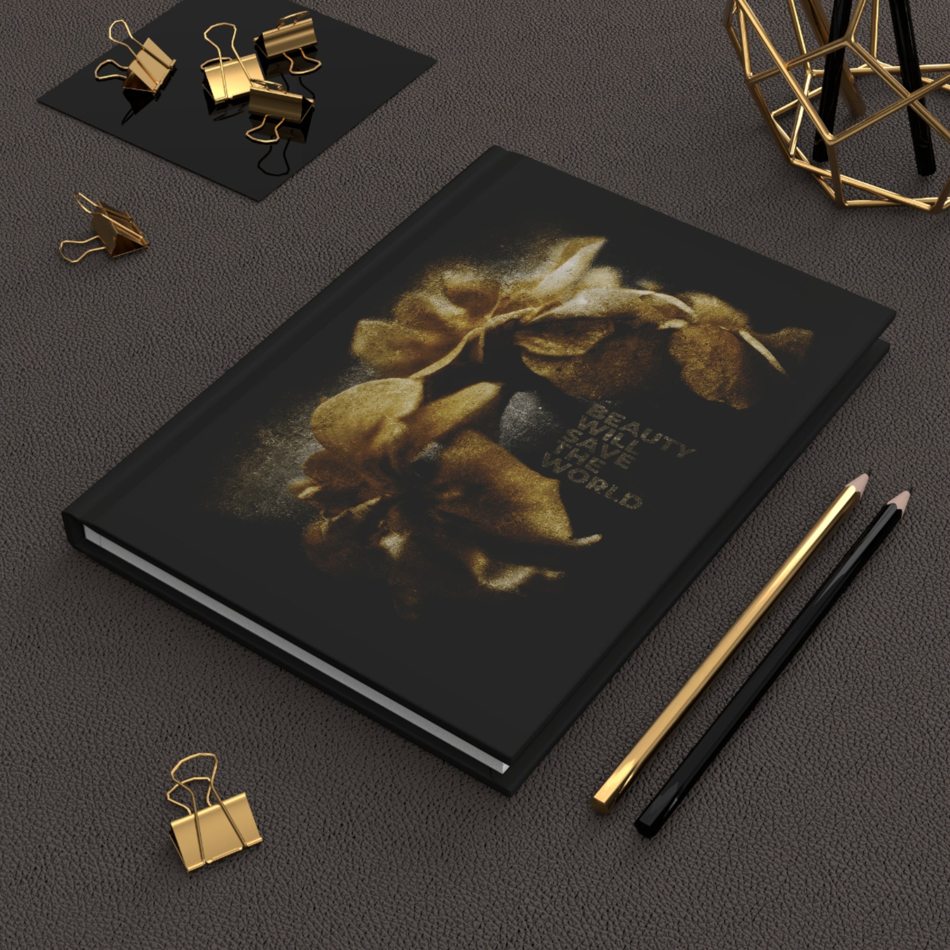 The "Beauty Will Save the World | Dostoevsky" Christian blank journal, featuring gold flowers and inspiring photography, celebrates Jesus Christ, Universal Creator & King—perfect for writing at your desk with pencils and gold clips.