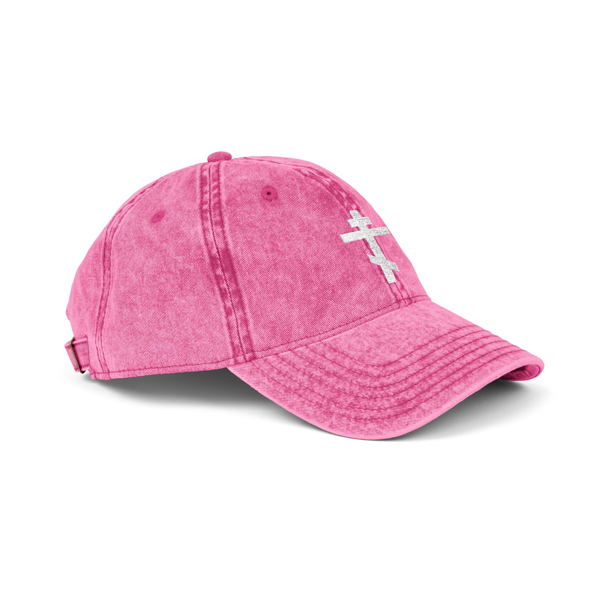 A minimalist pink cap featuring a white Orthodox tri-bar cross, symbolizing Christ’s sacrifice. "Crucify My Ego to the Precious and Life Giving Cross" embroidered in a simple, distressed style for Christian inspiration.