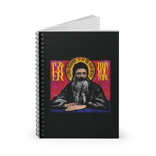 A Christian spiral notebook featuring a stained glass design of Fr. Seraphim Rose, American Orthodox monastic saint, with the words "It Is Later Than You Think" on the cover—a reminder of salvation and the Kingdom of Heaven.