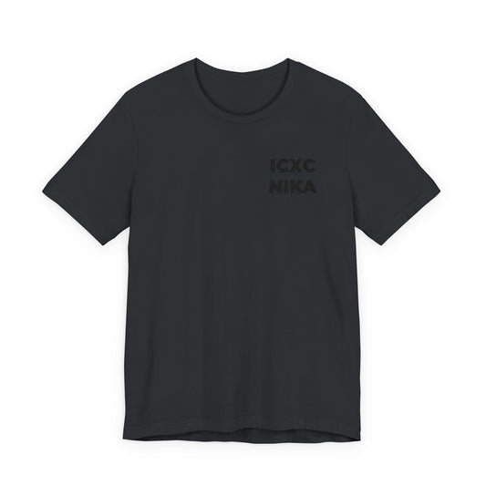 Vintage Black cotton unisex t-shirt featuring a subtle black-on-black embroidered ICXC NIKA Christogram—an Orthodox symbol meaning "Jesus Christ Conquers"—on the upper left chest.