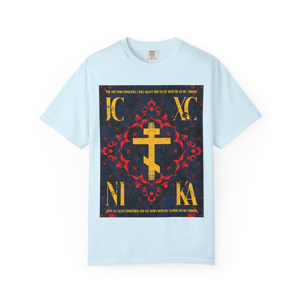 Chambray T-shirt featuring a gold IC XC NIKA Orthodox Cross with red, yellow, and white medieval floral designs and decorative text on a dark background, symbolizing the grace of God. This Heavyweight Cotton Unisex T-Shirt is inspired by “The One Who Conquers” (Revelation 3:21).