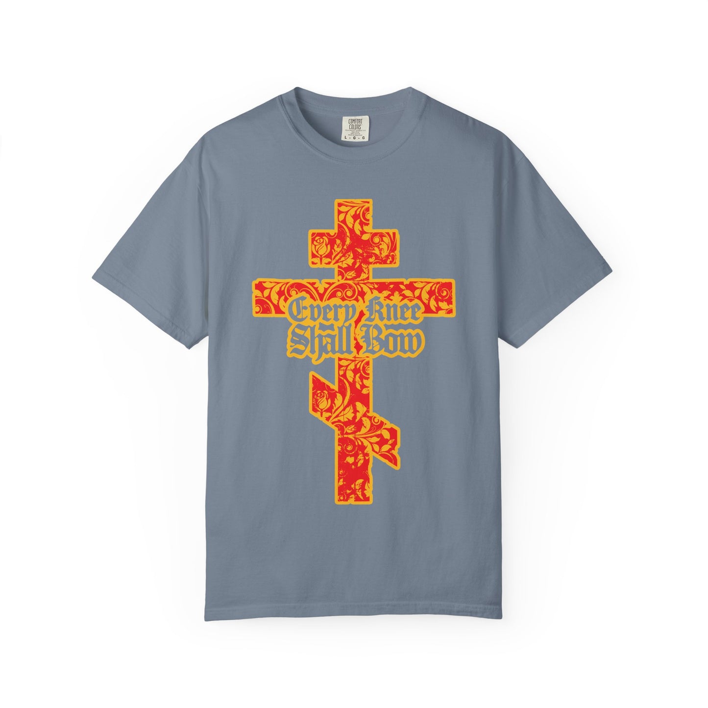 Blue Jean heavyweight cotton unisex tee featuring a gold and red floral texture Orthodox cross with gothic “Every Knee Shall Bow” text on the front, inspired by Isaiah 45:22-24 and Philippians 2:7-11.