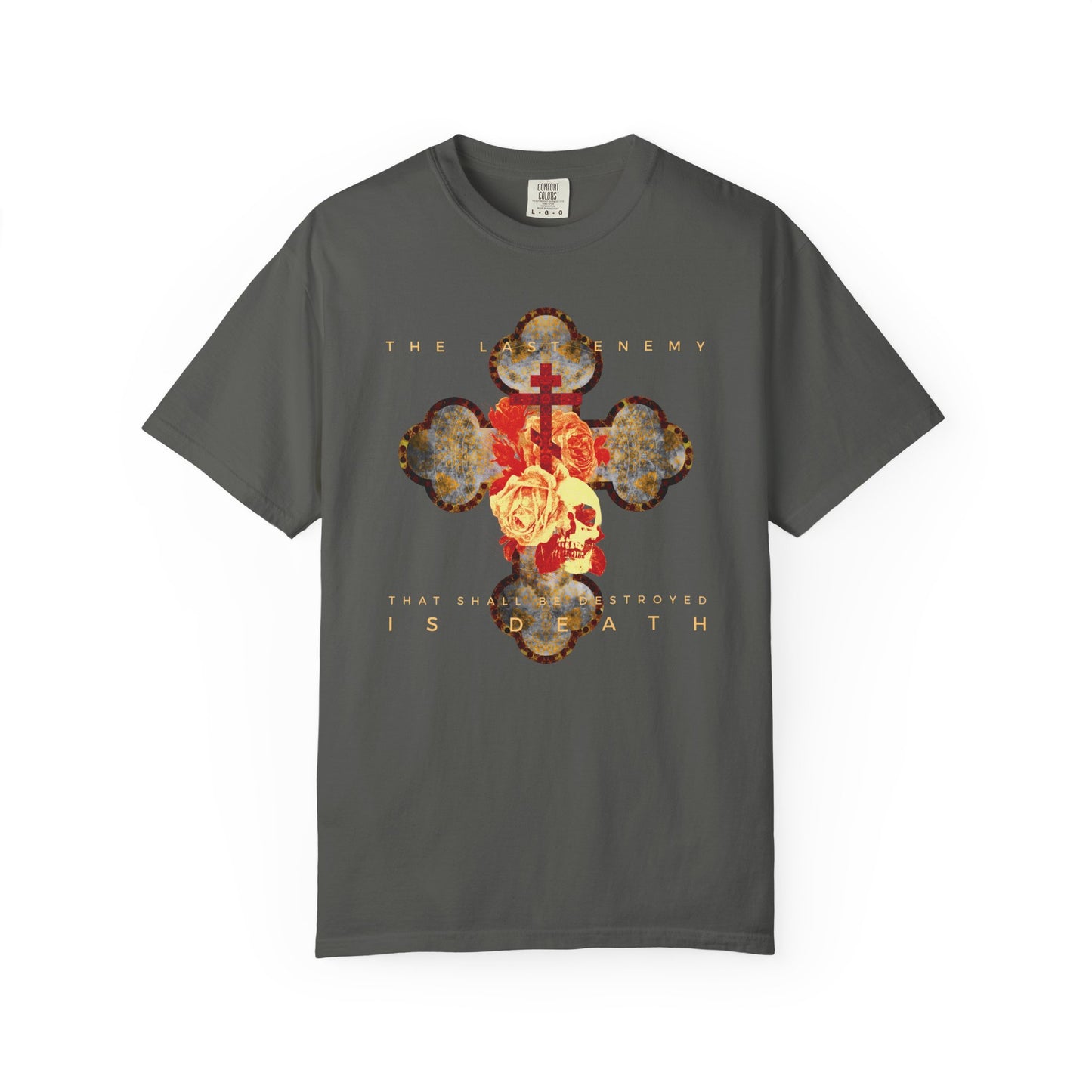 Pepper-colored heavyweight cotton unisex t-shirt featuring a metallic gothic cross, rose, and skull design with "The Final Enemy That Shall Be Destroyed Is Death" (1 Cor 15:26) text; inspired by Christ’s resurrection promise.