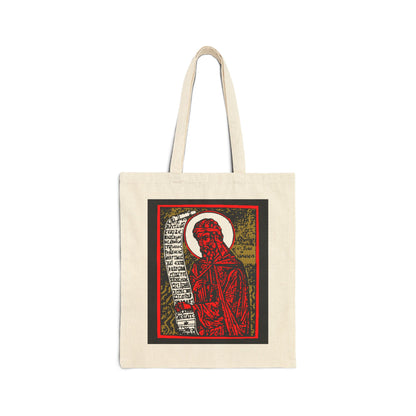 Natural cotton tote bag featuring a high-contrast red, gold, and black St. John of Damascus icono-graphic with handwritten Orthodox hymn text on the front.