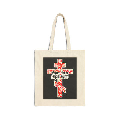 Beige tote bag with a gold and red floral Orthodox cross and gothic "Every Knee Shall Bow" lettering, inspired by Isaiah 45:22-24 and Philippians 2:7-11—declaring Jesus Christ is Lord.