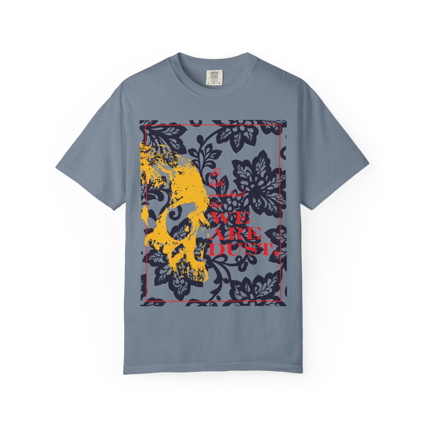 Blue jean t-shirt featuring a yellow skull on a blue floral background and bold red text reading "WE ARE DUST," inspired by Psalm 102—serving as a memento mori and reminder of the Lord’s compassion and mercy within our fleeting existence.