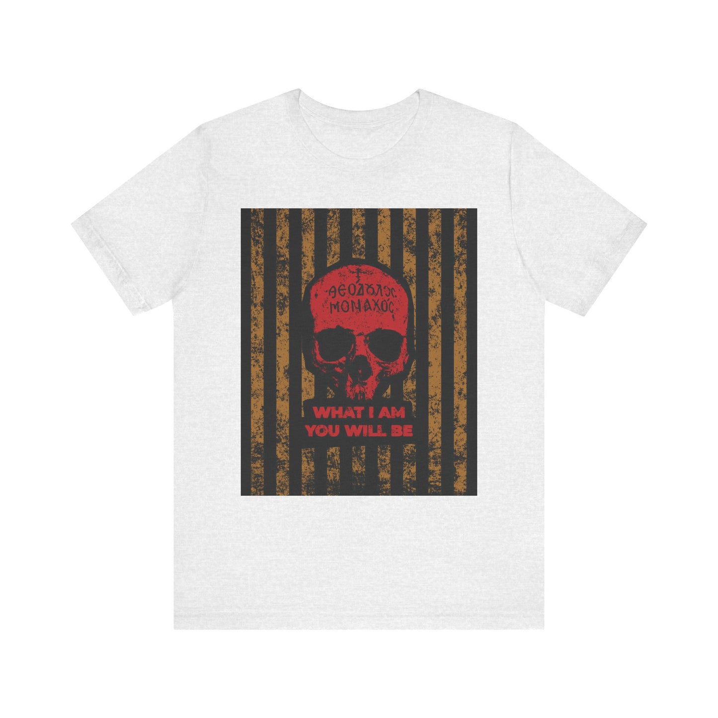 Ash-colored lightweight cotton unisex t-shirt featuring a red Mt. Athos monk skull, Greek script, and the phrase "WHAT I AM YOU WILL BE," inspired by St. Ignatius Brianchaninov’s teachings on remembrance of death (memento mori) and spiritual mortality, all set against a black and brown striped backdrop.