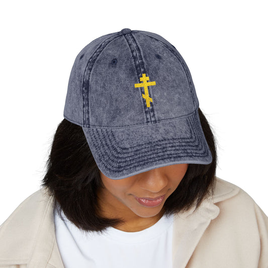 Woman wearing a Simple Yellow Orthodox TriBar Cross minimalist Christian distressed cap, featuring "Crucify My Ego to the Precious and Life Giving Cross" and a yellow Byzantine-style cross embroidered on the front.