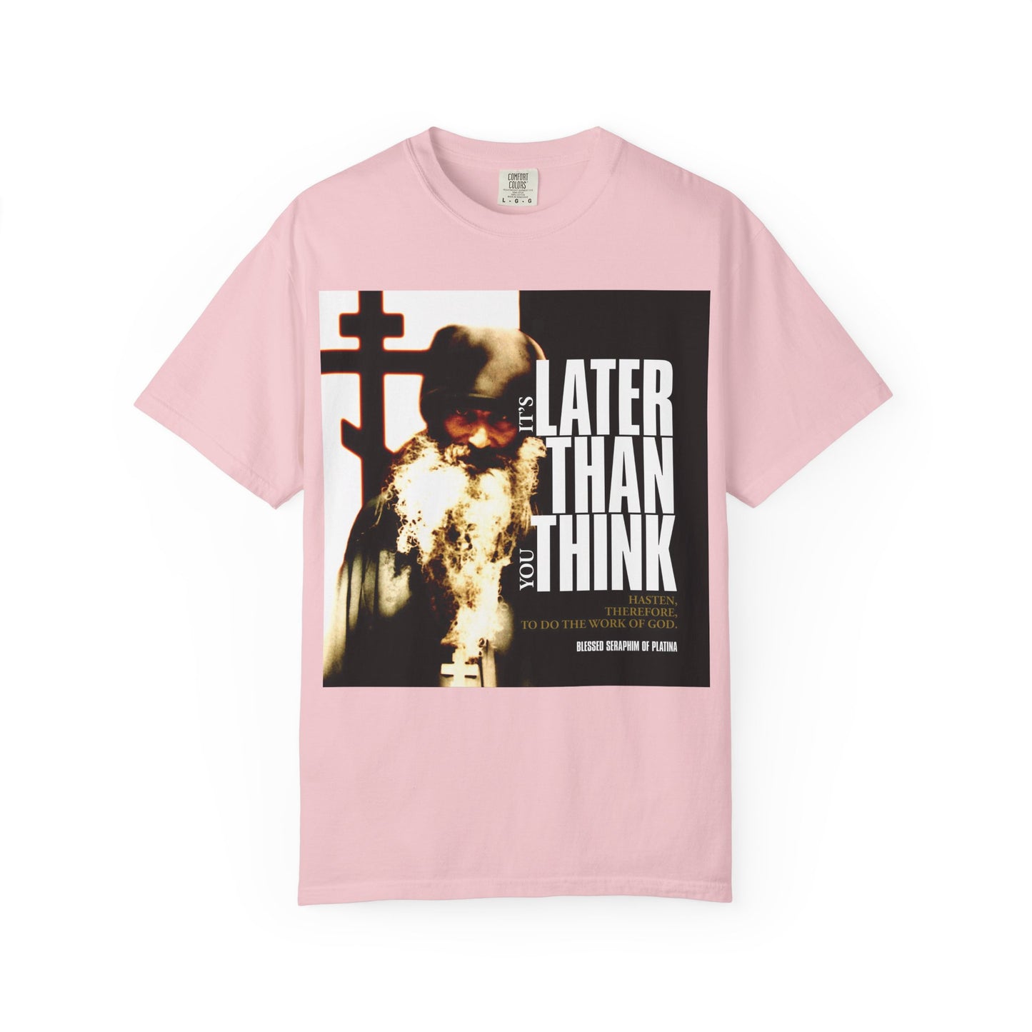 Blossom-colored heavyweight cotton unisex t-shirt featuring Fr Seraphim Rose with bold cinematic poster typography: "It's Later Than You Think"—a call to reflect and seek God.