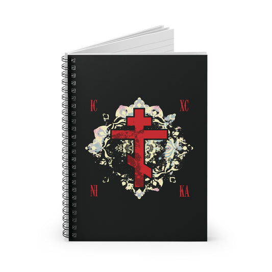 The ICXC NIKA Means Jesus Christ Conquers spiral notebook features a textured red Orthodox cross with a medieval floral background, inspired by St John of Kronstadt and Christian spiritual warfare themes.