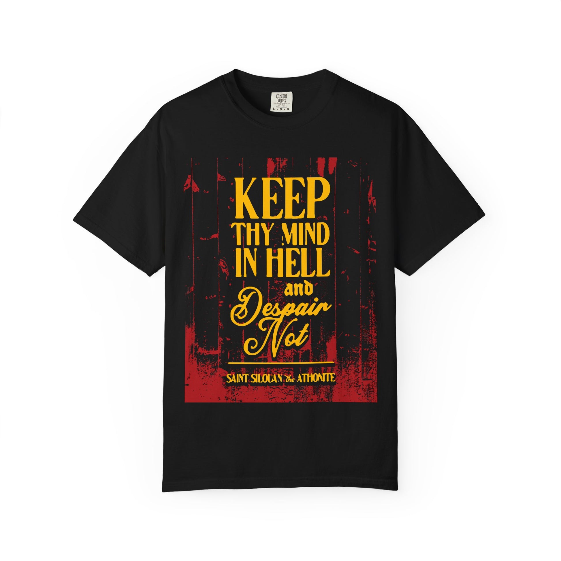 This black heavyweight cotton unisex tee, titled "Keep Thy Mind in Hell and Despair Not (St. Silouan the Athonite) | Modern Russian Elder | Orthodox Christian," features bold yellow and red text with St. Silouan’s profound reminder of spiritual resilience and the strength found in a pure, prayerful mind.