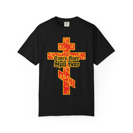 Black heavyweight cotton unisex tee featuring a gold and red floral texture Orthodox cross with gothic letters spelling out “Every Knee Shall Bow,” inspired by Isaiah 45:22-24 and Philippians 2:7-11.