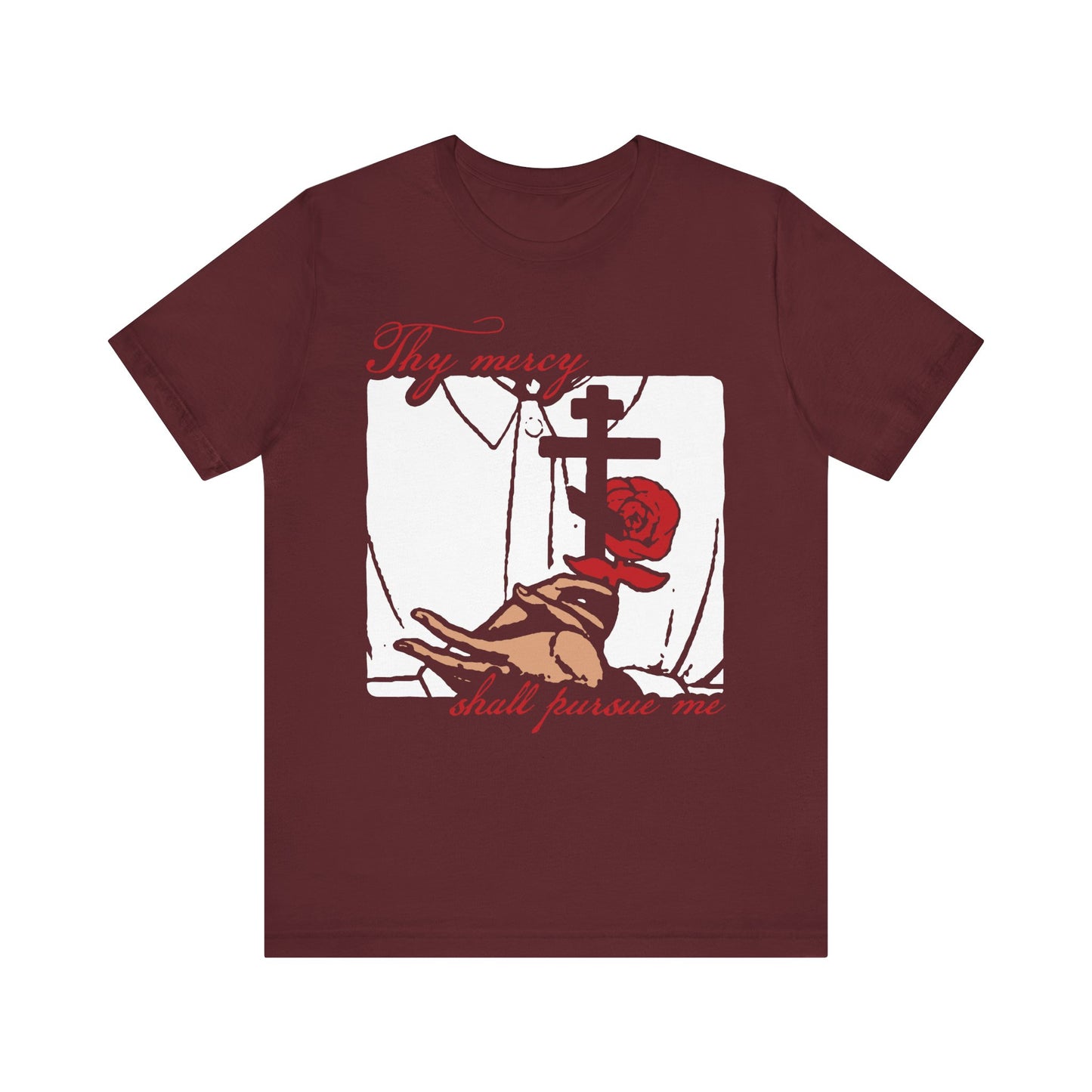 The maroon "Thy Mercy Shall Pursue Me - Psalm 22 (23)" lightweight cotton unisex t-shirt features art in an icono-graphic style, depicting hands holding a rose and an Orthodox Martyr's Cross, with red text reading "Thy mercy shall pursue me," inspired by Psalm 23 and the righteous path led by the Lord as shepherd.