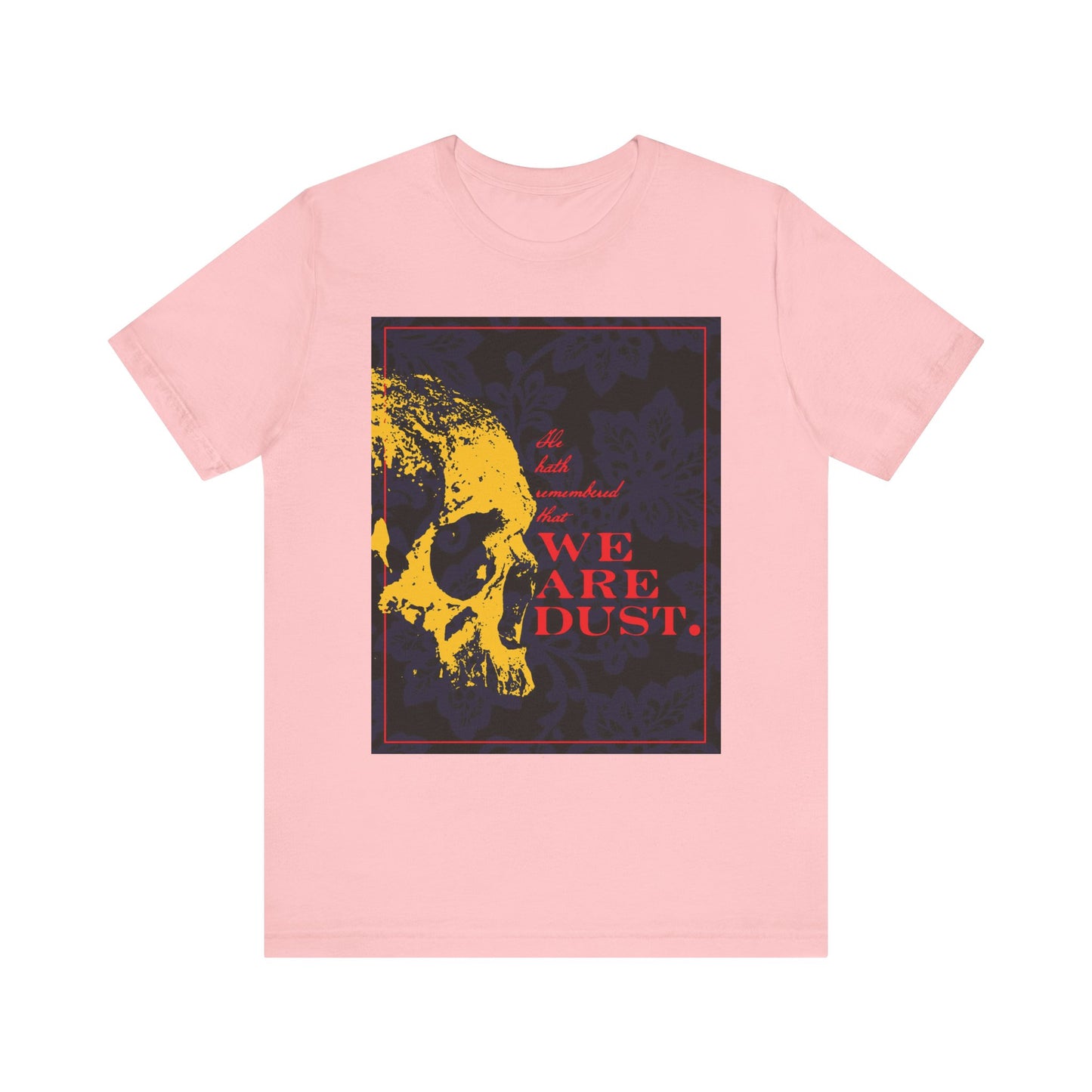 Pink "We Are Dust" unisex T-shirt featuring a yellow skull, red text, and blue floral background—memento mori inspired by Psalm 102 LXX. Lightweight gothic cotton style.