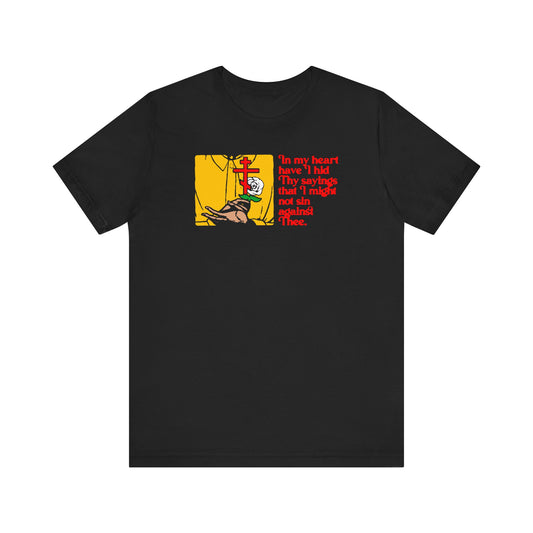 Black "In My Heart Have I Hid Thy Sayings (Psalm 117/118) 1" Orthodox Christian lightweight cotton unisex t-shirt featuring a graphic of a person kneeling at a cross and red text inspired by the commandments and the law of the Lord from Psalm 117/118.