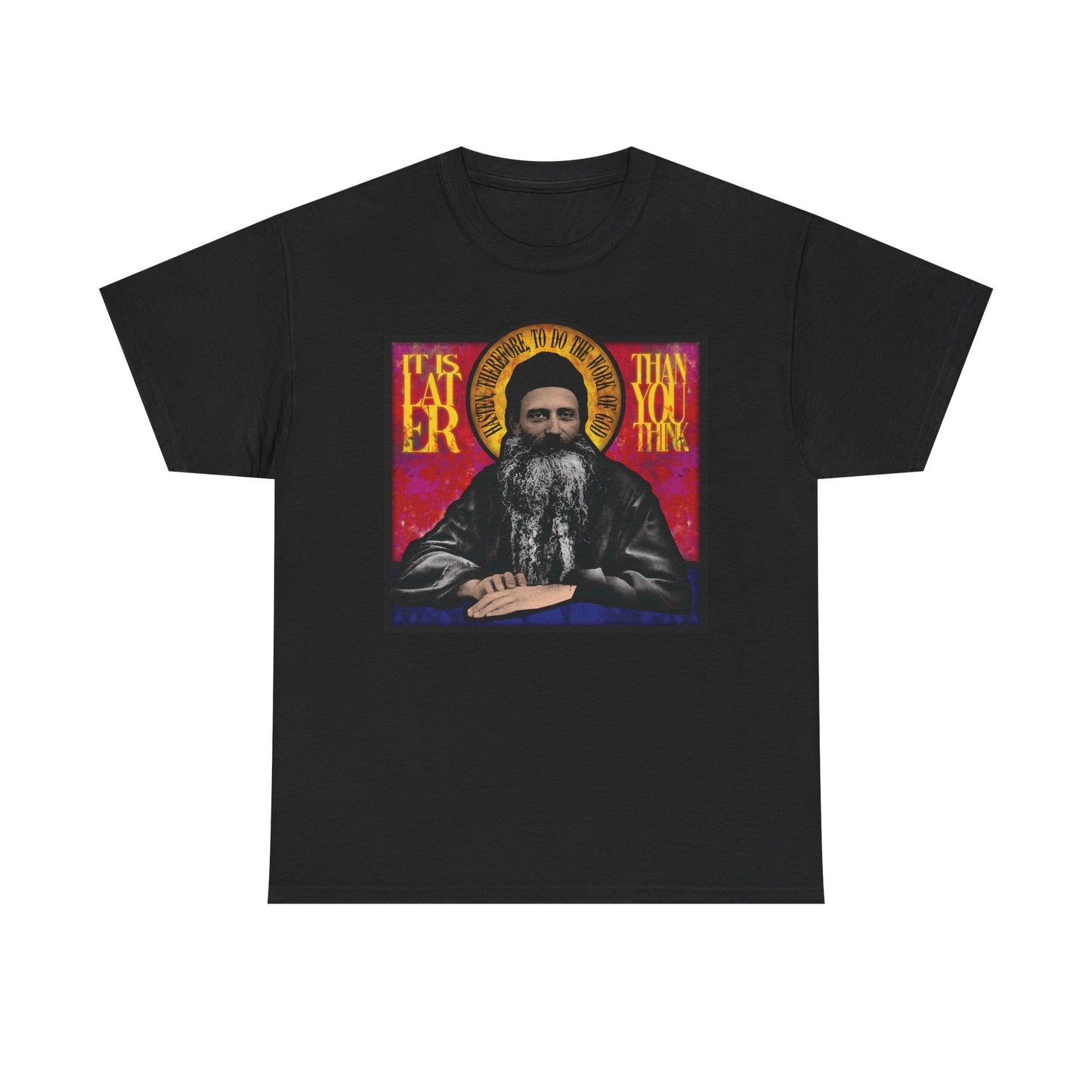 Black midweight cotton unisex T-shirt featuring a stained glass design of Fr. Seraphim Rose, American Orthodox monastic saint, with the phrase "It Is Later Than You Think" in yellow text—a reflective reminder of salvation and the promise of the Kingdom of Heaven.