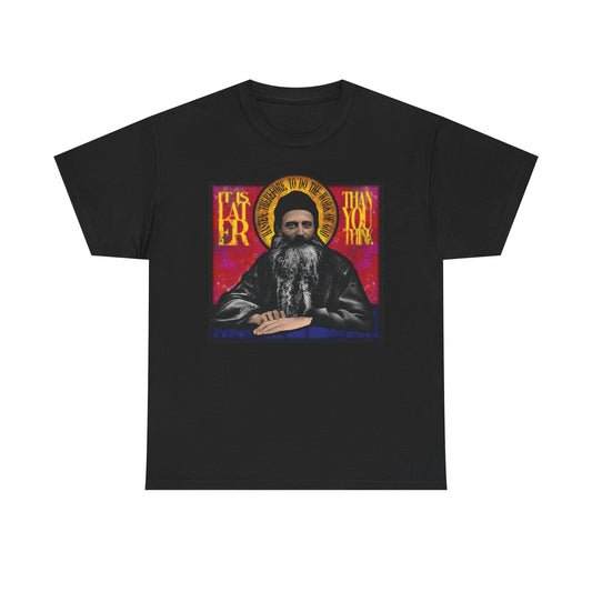 Black midweight cotton unisex T-shirt featuring a stained glass design of Fr. Seraphim Rose, American Orthodox monastic saint, with the phrase "It Is Later Than You Think" in yellow text—a reflective reminder of salvation and the promise of the Kingdom of Heaven.