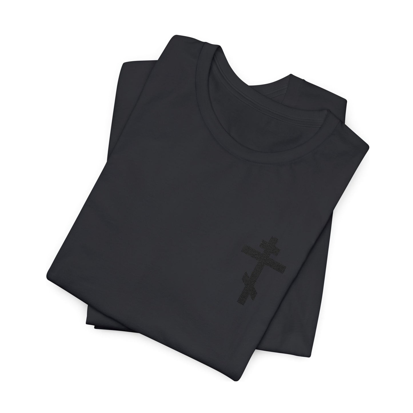 Two folded black cotton unisex t-shirts featuring a subtle black embroidered Orthodox cross, inspired by Galatians 6:14: "May I Never Boast Except in the Cross of Christ.