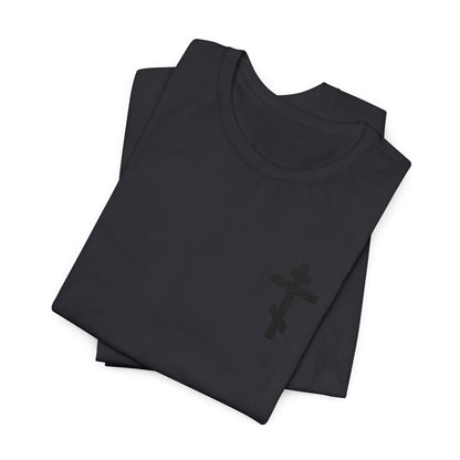 Two folded black cotton unisex t-shirts featuring a subtle black embroidered Orthodox cross, inspired by Galatians 6:14: "May I Never Boast Except in the Cross of Christ.
