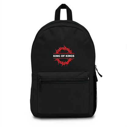 Black backpack named "King of Kings Crown of Thorns | The King of Glory | Christ is King | Revelation 19:16" with a red crown of thorns and KING OF KINGS text on the pocket, inspired by Revelation 19:16.