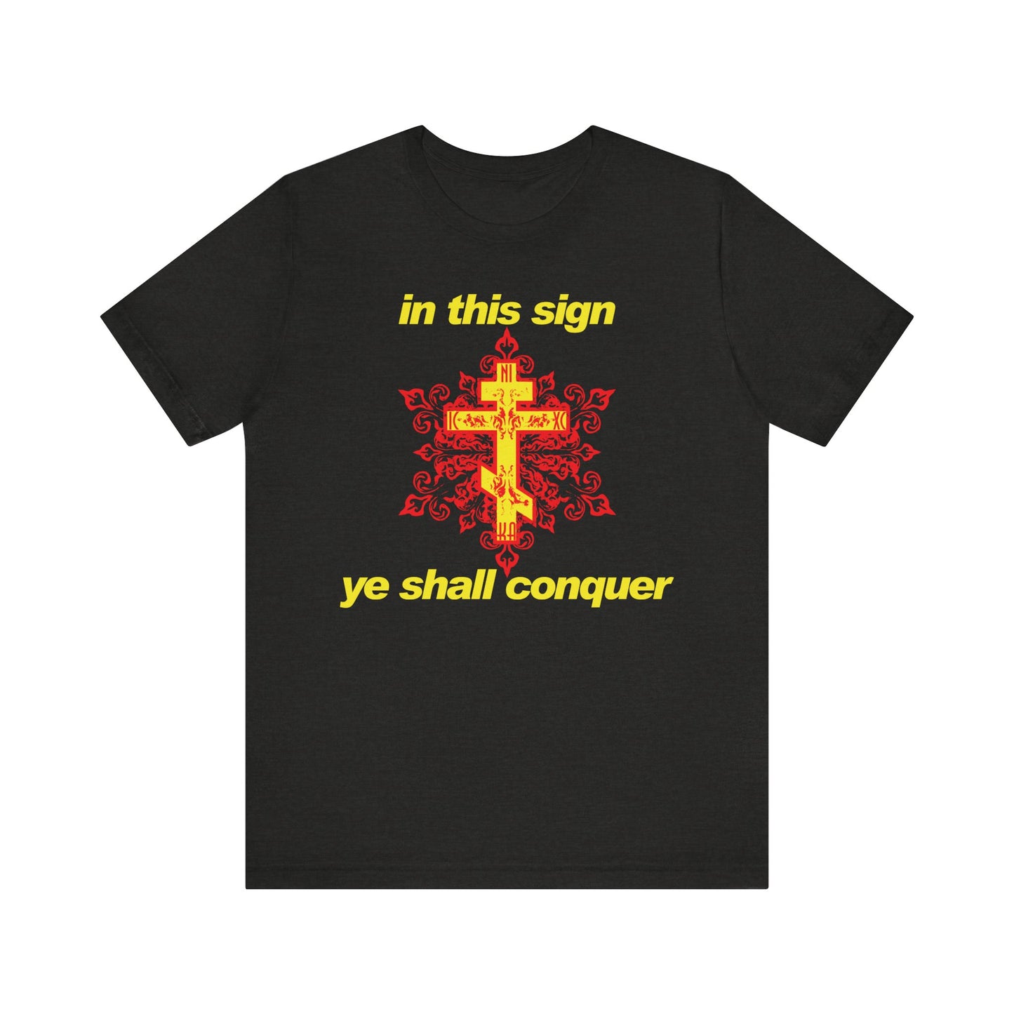 Black Heather t-shirt featuring a bold red and yellow cross design with modern typography stating "In This Sign Ye Shall Conquer," inspired by Orthodox Christian tradition and the spiritual practices of saints like St Theophan the Recluse.