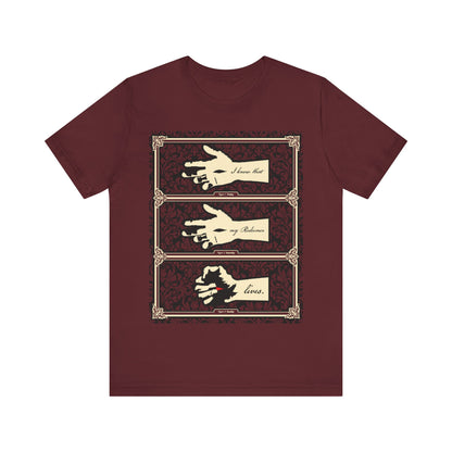 Maroon t-shirt featuring the Hand of the Crucified Christ with "I Know That My Redeemer Lives" (Job 19:25) in earthtone Americana style—an Orthodox Christian design reflecting resurrection and faith.