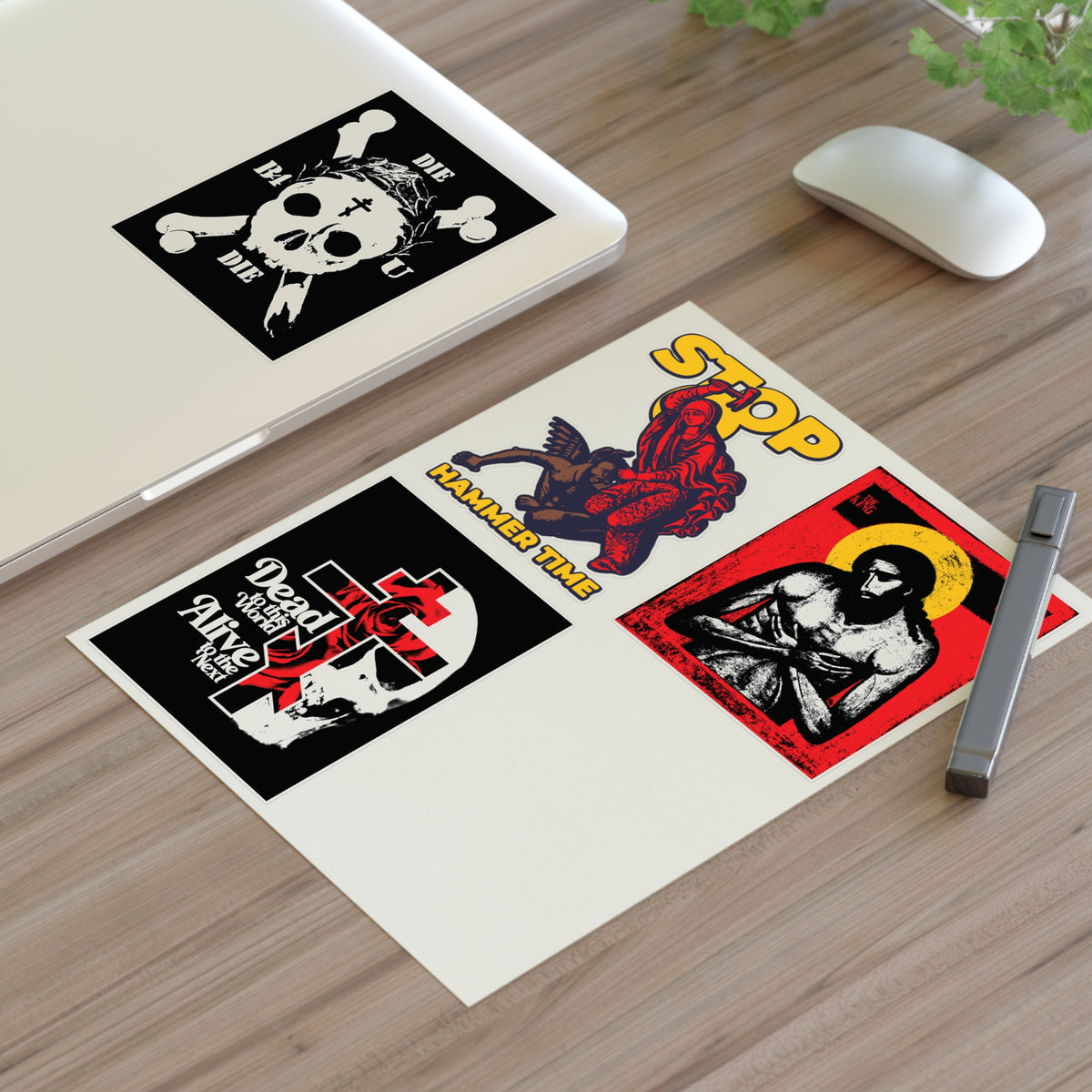 Random Mix No. 1 Four Sticker Sheet on a wooden desk near a laptop, pen, and mouse.