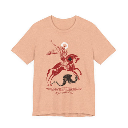 Heather Peach t-shirt featuring a graphic of St George slaying the dragon, inspired by St John Climacus and the theme “Those Who Mourn Over Their Sins,” with text beneath the illustration.