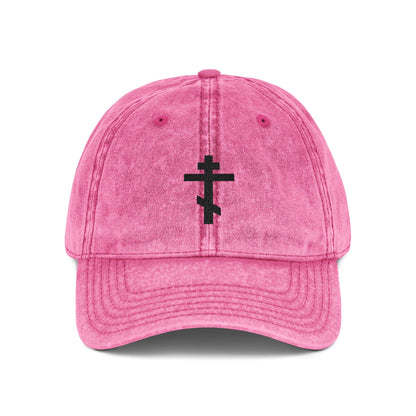 Pink "Simple Black Orthodox TriBar Cross" cap, featuring a minimalist distressed black cross design and "Crucify My Ego to the Precious and Life Giving Cross" embroidery; perfect for Christian style.